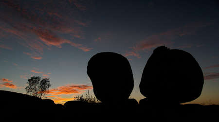 Devils Marbles in Australia, huge round red rocks, sunsetの写真素材