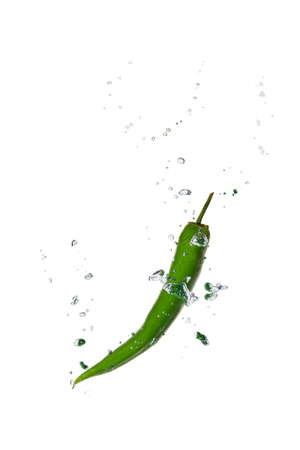 Green chili in water with air bubblesの写真素材