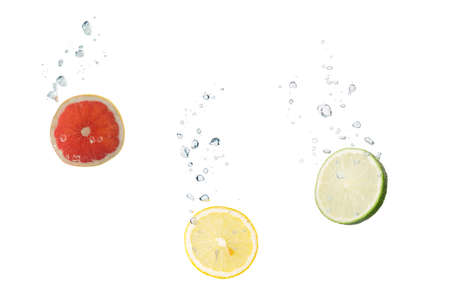 Grapefruit, lemon, lime in water with air bubblesの写真素材
