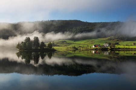 Norway Landscape with lake and fogの写真素材