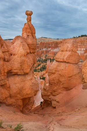 Red rock towers called Hoodoo in National Park Bryce Canyon, dramatic overcast sky, USAの写真素材