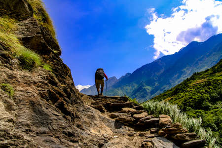 Treeking upto to steep hills through the beautiful green landscapes in Manaslu Region is challenging but overwhelming.の写真素材