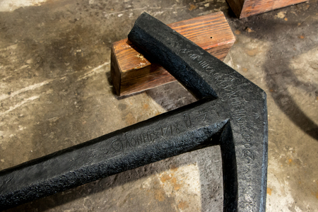 Restoration of old anchors in the workshop, underwater archaeological finds