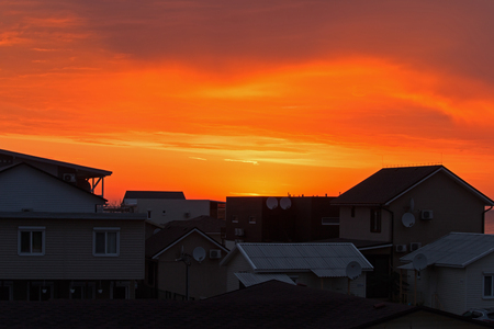 Dawn over the cottages, serene landscape, colorful sunriseの写真素材