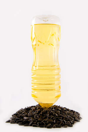 bottle of oil in sundlower seedsの写真素材