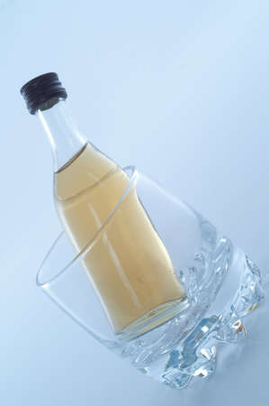 bottle of rum inside glassの写真素材