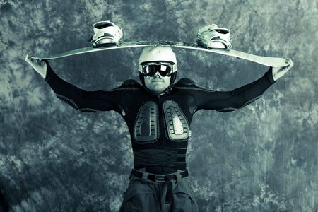 The guy with snowboard in the handsの写真素材