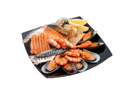 Steak with fried fish, mussels and prawnsの写真素材