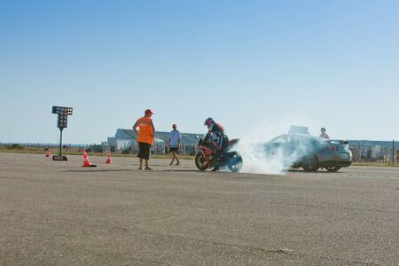 SEVASTOPOL, UK - 06 August: smoke from under the wheel of the motorcycle before the race,...