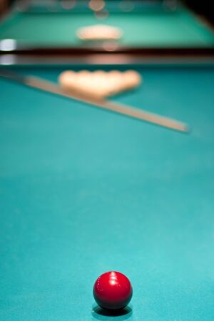 arrangement of balls and a cue to play Russian billiards