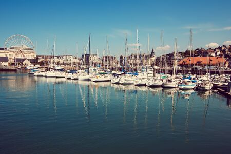 Yachts moored in the bay in the rays of the sunの写真素材