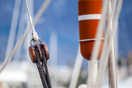 Running rigging gear and sailing rope. Ship tackles on on board yacht.の写真素材