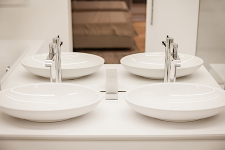 Luxury bathroom with two sinks and mirror in the hotelの写真素材