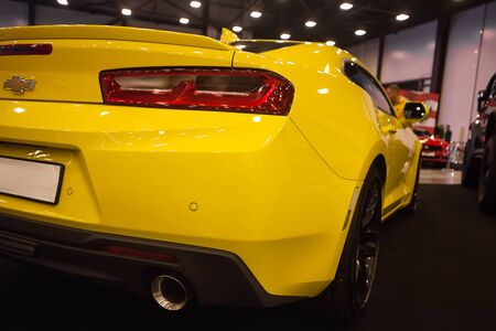 SAINT-PETERSBURG, RUSSIA - JULE 23, 2017: Back view of Yellow Chevrolet Camaro on Royal Auto Show. Close up of Car trunk and backlight.のeditorial素材
