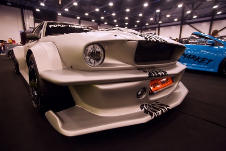 SAINT-PETERSBURG, RUSSIA - JULE 23, 2017: Front view of car Ford Mustang with tuning on Royal Auto Show. Wide Car Fender and bumper. Close up of Car hood and radiator with headlampのeditorial素材