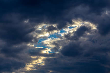 Cloudscape, background sky with reflected rays of the sun in cloudsの写真素材