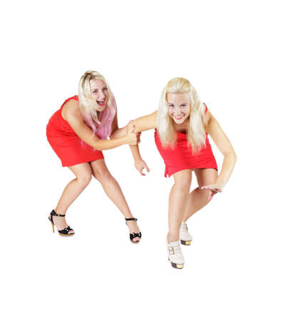 Crazy happy smiling blonde girls in red dresses on high heels isolated on white backgroundの写真素材