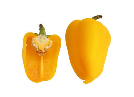 a ripe bell yellow pepper and half of the pepper isolated on white backgroundの写真素材