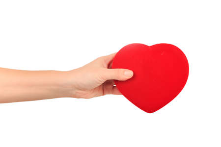 female hand holding big bright red heart on white background. Love, marriage, engagement, Valentine's day conceptの写真素材