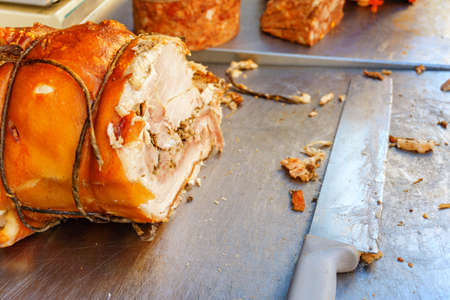 a great tasty juicy piece of baked ham and knifeの写真素材