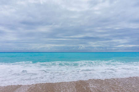 Ideal Caribbean empty beach with azure sea in rainy weatherの写真素材