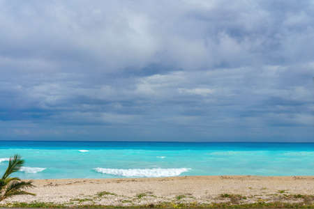 Ideal Caribbean empty beach with azure sea in rainy weatherの写真素材