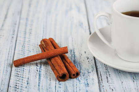 white coffe cup on light wooden tableの写真素材