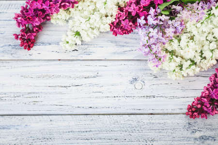 Fresh lilac flowers on the wooden vintage backgroundの写真素材