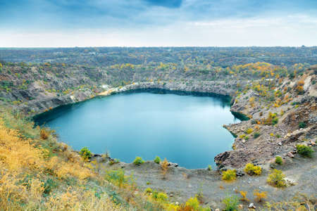 great radon blue lake, granite quarry in autumn, picturesque landscape, natural backgroundの写真素材