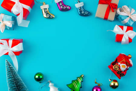 christmas or new year frame composition with copy space in centre on blue background. Flat lay, top view, copy spaceの写真素材