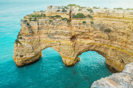 double rocky arch over the sea. Ponta da Piedade, algarve, Portugalの写真素材