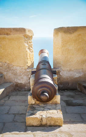 cannon in the wall of Santa Barbara castle in Alicanteの写真素材