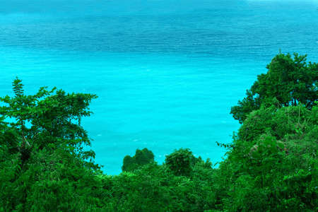 travel concept, azure Caribbean sea and green treesの写真素材