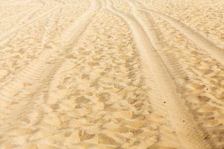 Wheel tire track or tread mark on sand, driving on sand