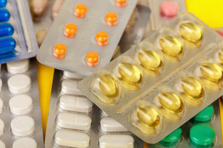 group of multi-colored pharmaceutical medication and medicine pills in packs close upの写真素材