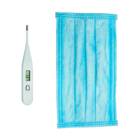 White thermometer and blue medical mask isolated on white background. Protection against pollution...