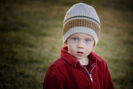 a young child wearing his hat