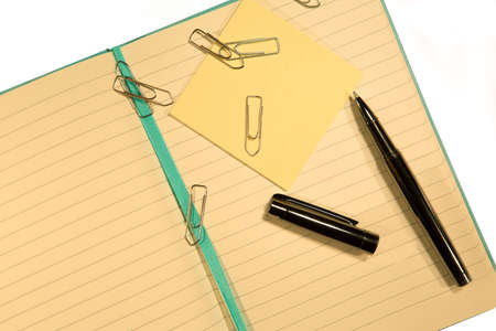 Open notebook with staplesの写真素材