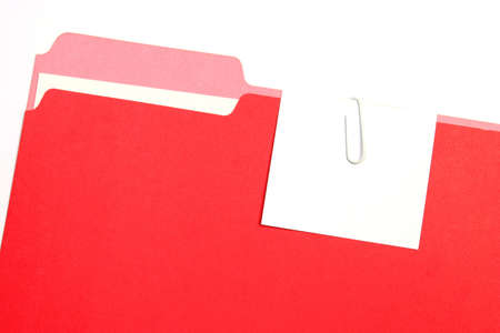 A red folder on a white background with an empty tag.の写真素材