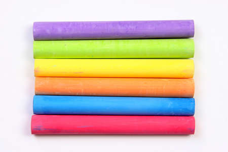 Colored chalks over a white background.の写真素材