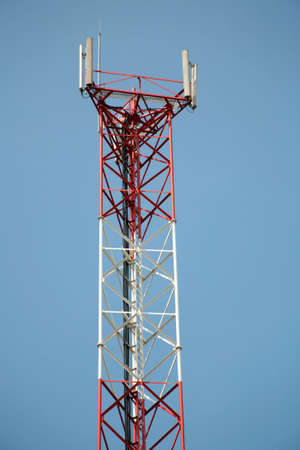 A cell antenna over a blue cloudless sky