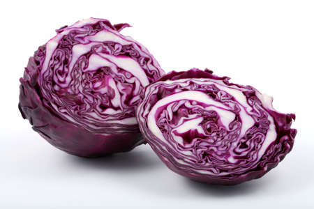 Purple leaved cabbage cut in half on a white background.の写真素材
