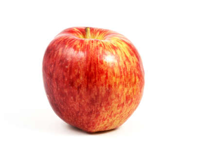 Horizontal view of an apple, red, over a white background.の写真素材