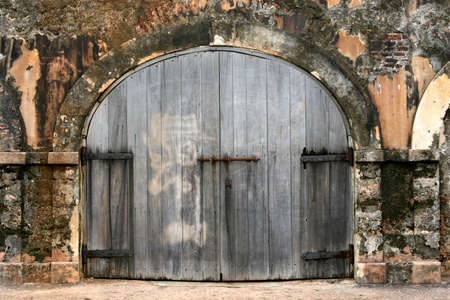 Dark wooden doors in a colonial site at Puerto Rico.の写真素材