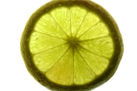 Thin lemmon slices in a backlit setting for high-key exposure and taken with a macro.の写真素材