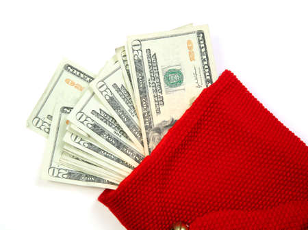 Christmas sock with season's details and money in it illustrating the concept of money spending.の写真素材