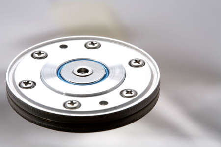 Hard disk drive silver shiny surface and rotor mechanism shown open.の写真素材