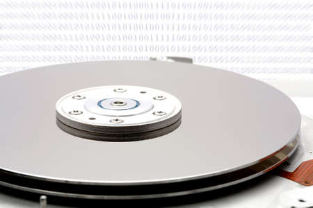 Hard drive with data composed from zeros and ones.の写真素材
