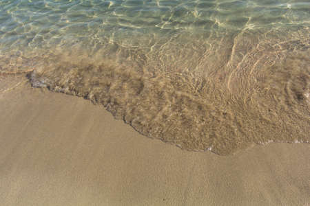 Photos of the Beach by the sea, with a small waveの写真素材