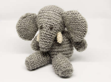 Photo of a small elephant puppet, on a white backgroundの写真素材